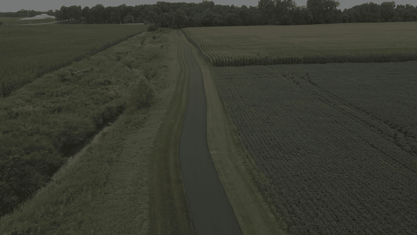 Aerial view of farmland and road
